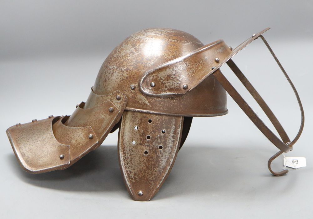 A reproduction English Civil War lobster tail helmet, length 49cm approx.